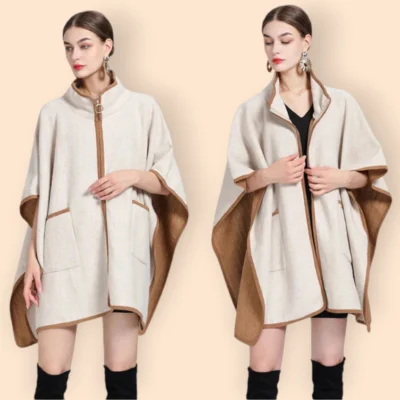 Poncho veste femme creme élégant avec ourlets marron, modèle sophistiqué en tenue minimaliste.